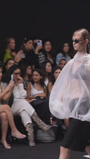 Load and play video in Gallery viewer, HIGH NECK BALLOON TOP WITH ATTACHED HOODIE PAIED WITH A BRA